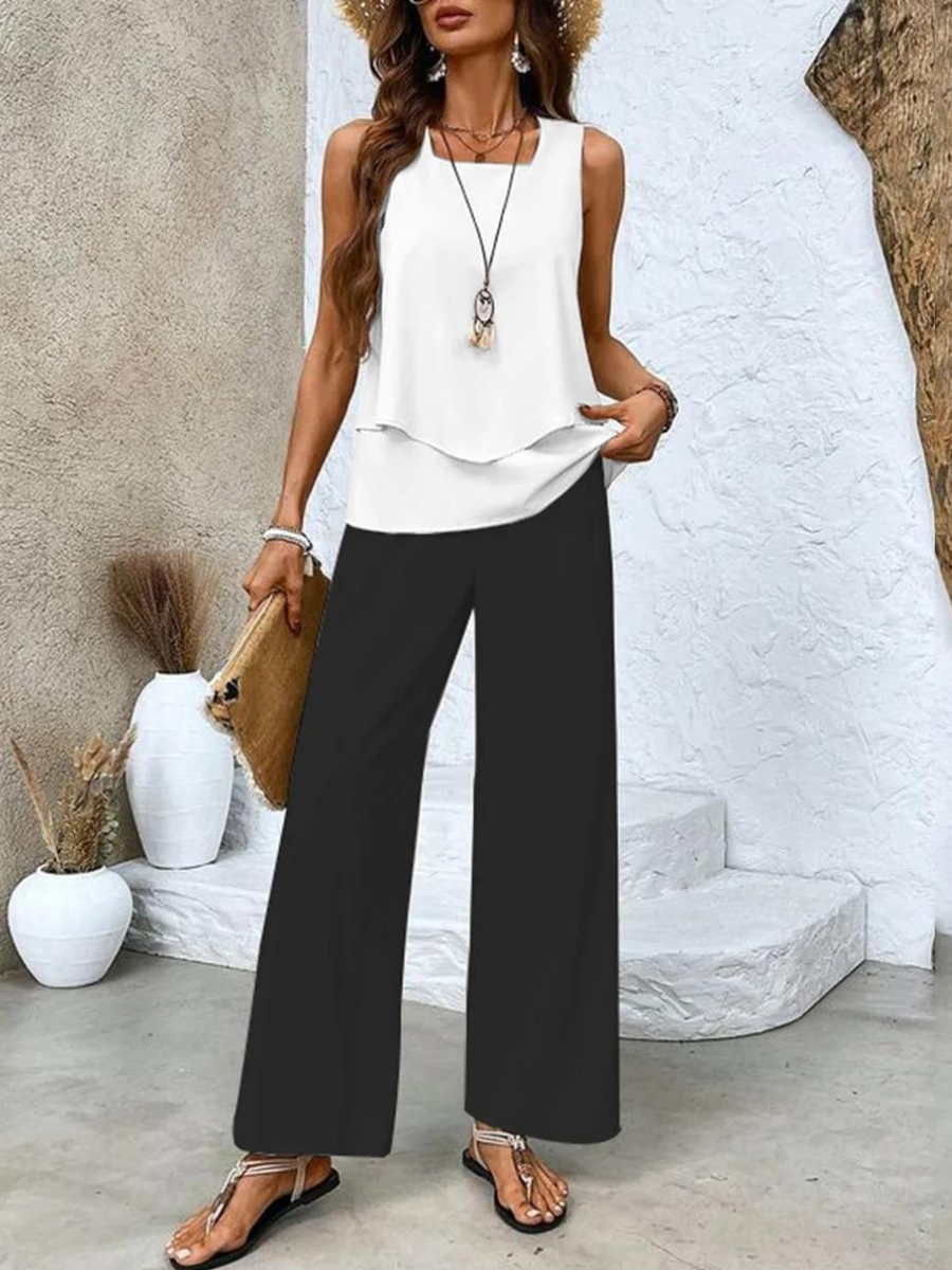 Completo da donna Ghislaine: elegante top e pantaloni con stampa floreale, vestibilità comoda e valorizzante